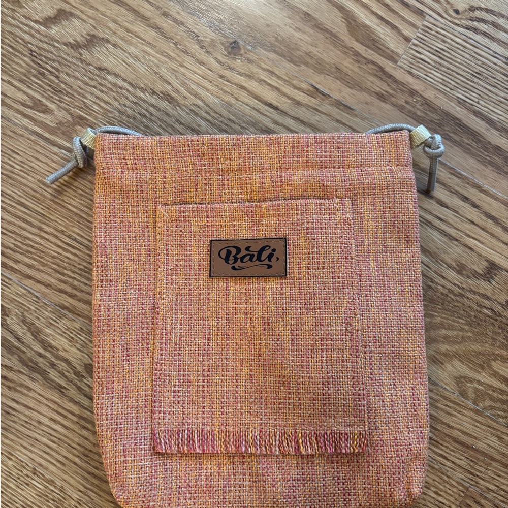 Bali Small Woven Drawstring Pouch in Peach and Coral